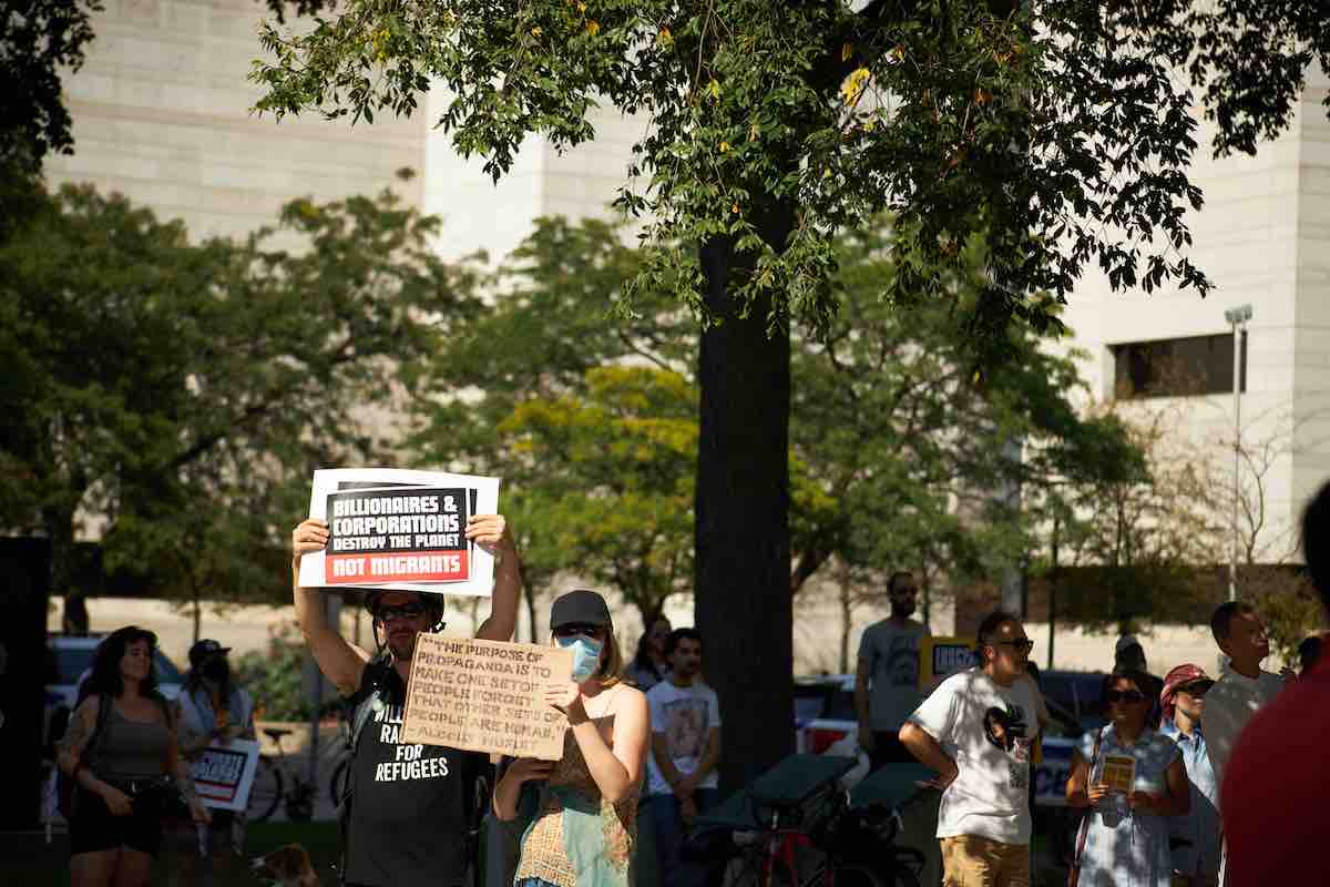 Demonstrators gathered at a Status for All rally