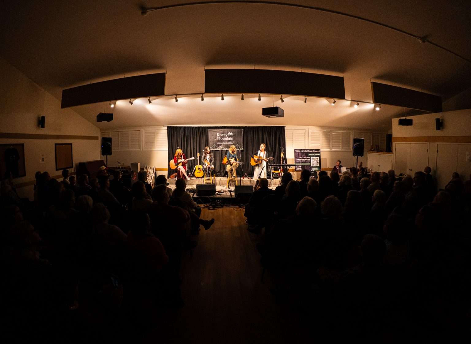 Performers on stage at a Canadian folk-roots venue